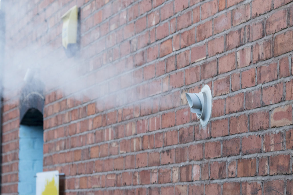 a large plume of water vapour from a boiler flue could look like a boiler on fire