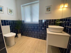 kitchen to bedroom conversion completed window side of ensuite showing toilet and sink