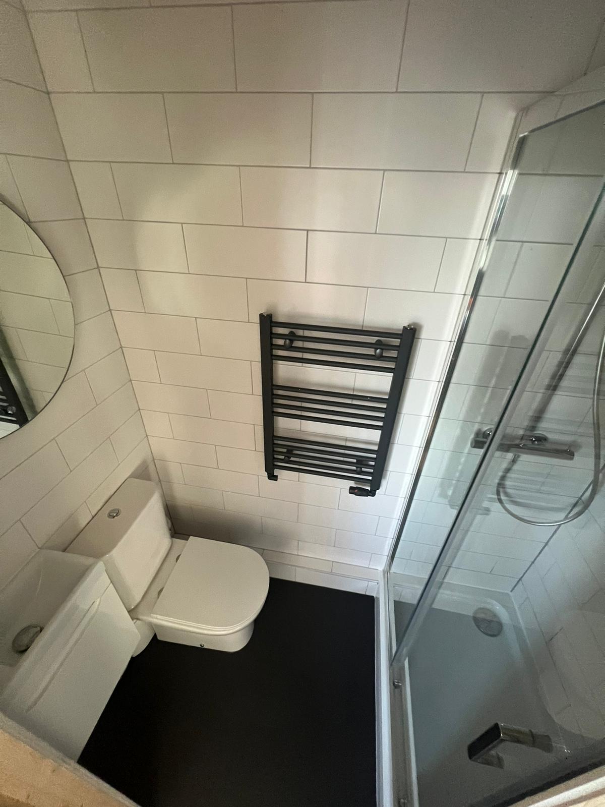 Create an ensuite view from ceiling showing decent floor space in this small room