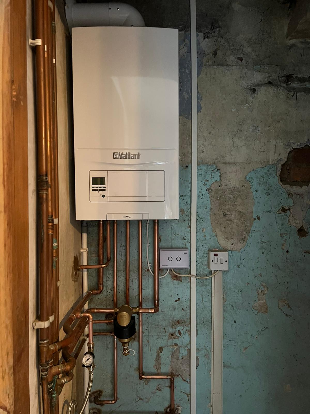 combi boiler swap new Vaillant ecoFIT Pure 825 boiler installed, plus 4 new radiators and powerflushed system.
