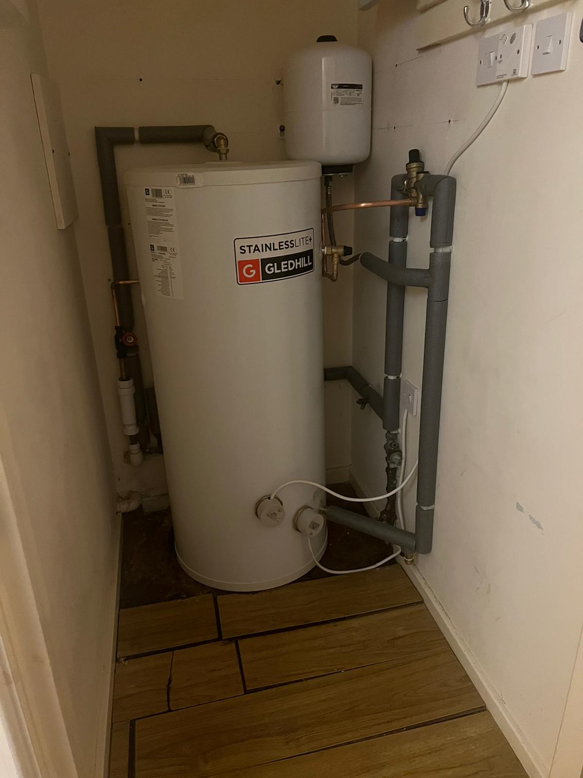 Faulty thermal store replaced with unvented hot water cylinder.
