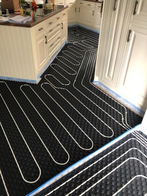 installation of underfloor heating pipes in nu-heat panels