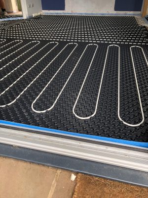 side profile image of nu-heat underfloor heating pipes in matrix