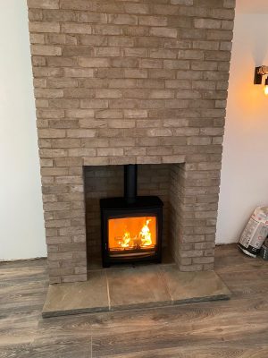 Testing completed installation of Aspect 8 Slimline SE Woodburning Stove