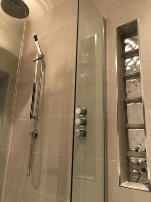 Bathroom renovation shower with concealed fittings and cube glass window feature