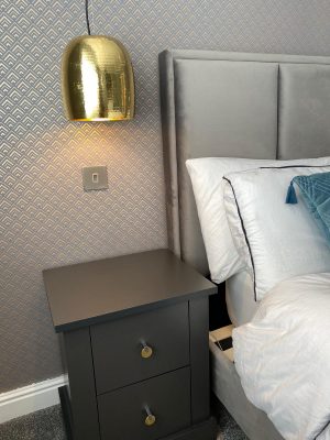 kitchen to bedroom conversion bedroom bedside table with drawers and ceiling mounted gold lampshades