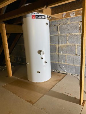 new unvented cylinder located on strengthened floor in loftspace before fitting pipework and components