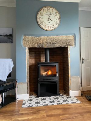 Dunsley Heat Advance 500 Stove installation complete with fireproof lined opening covered with brick slipped tiles