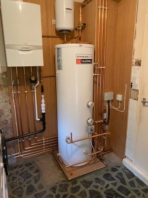 Complete heating system fitted including Vaillant Ecotec Plus, Gledhill unvented cylinder with remote expansion vessel, system zone valves and wiring. all pipework clipped to plywood back