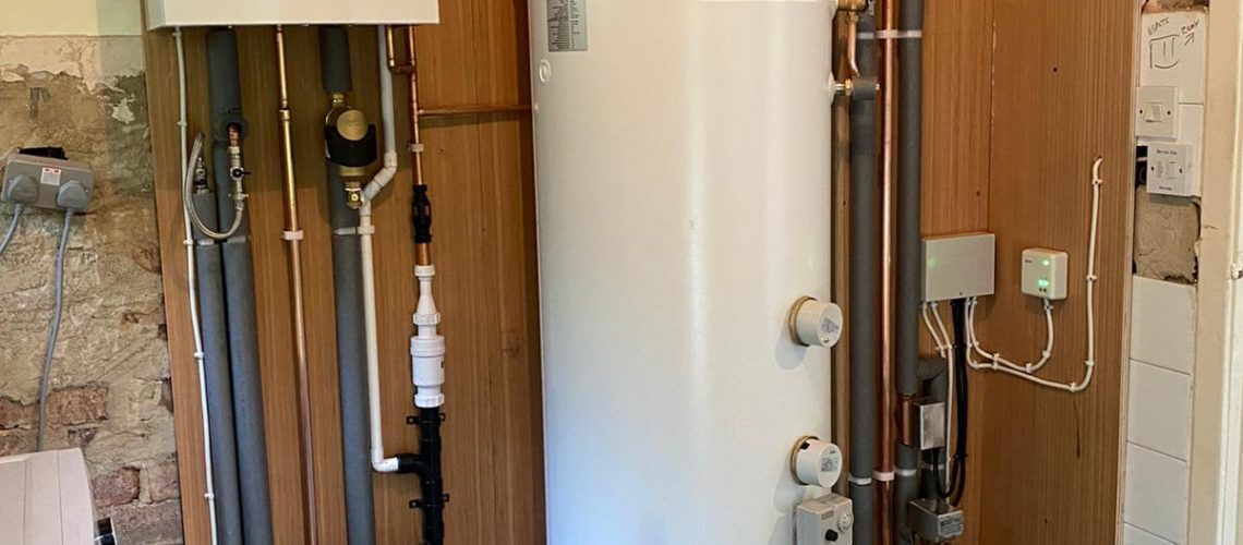 New Boiler in Yorkshire. Complete heating system fitted including Vaillant Ecotec Plus, Gledhill unvented cylinder with remote expansion vessel, system zone valves and wiring. all pipework clipped to plywood back and covered in pipe insulation where appropriate
