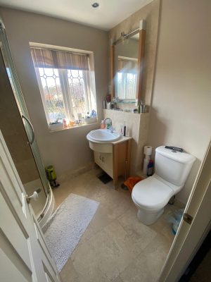 bathroom and ensuite project showing original ensuite with toilet further from the window and shower cubicle on plinth