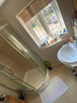 bathroom and ensuite project showing shower cubicle raised on a plinth due to pipework underneath cubicle