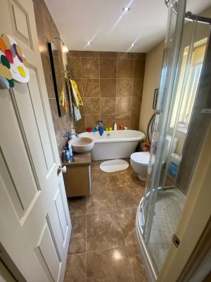 bathroom and ensuite project showing original bathroom with free standing bath and shower cubicle creating a cramped bathroom