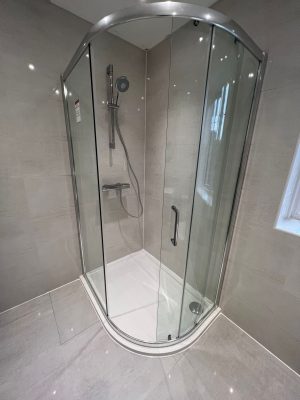 bathroom and ensuite project showing corner ensuite shower cubicle now flush with tiled floor