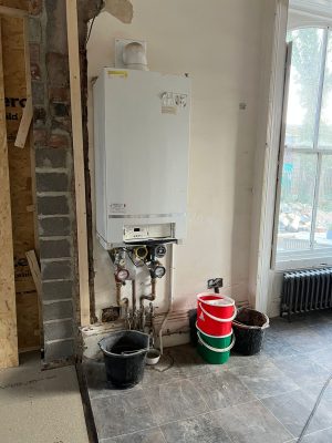 convert offices into a house project shows original boiler located on ground floor of property