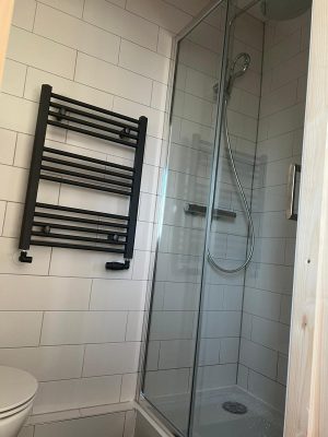 Create an ensuite and installed a space saving high level black towel rail