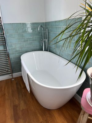 uneven bathroom floor new free standing bath in corner with free standing bath tap stand in far corner of bathroom and green gloss bathroom tiles