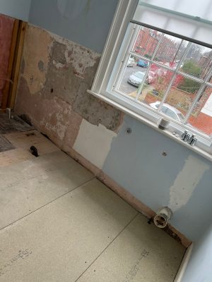 uneven bathroom floor rectified in bath area with chipboard flooring