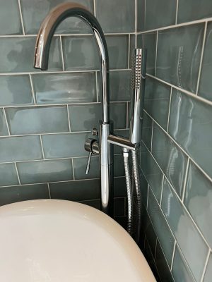uneven bathroom floor new free standing bath tap stand in far corner of bathroom and green gloss bathroom tiles